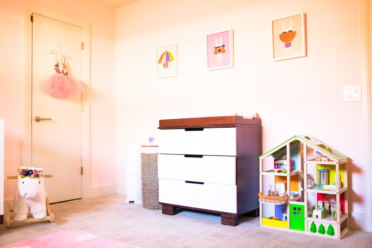 toddler girl pink nursery, diaper changing station setup, dollhouse, bunny wall prints