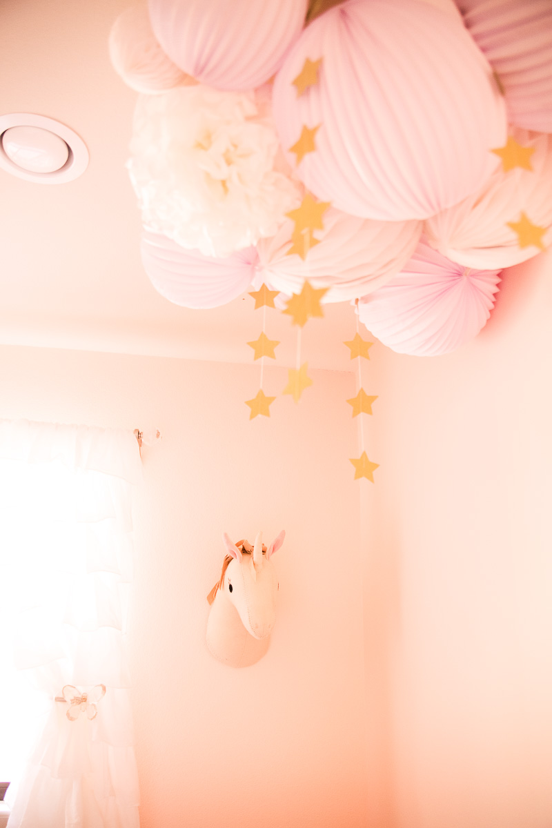 toddler girl pink nursery, pillowfort unicorn head, diy pom pom clouds falling stars