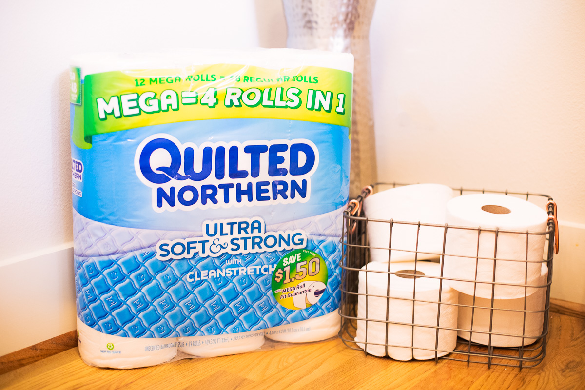 modern bathroom decor, toilet paper in wire basket, quilted northern mega roll