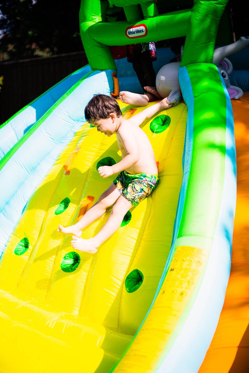 toddler superhero birthday party water slide