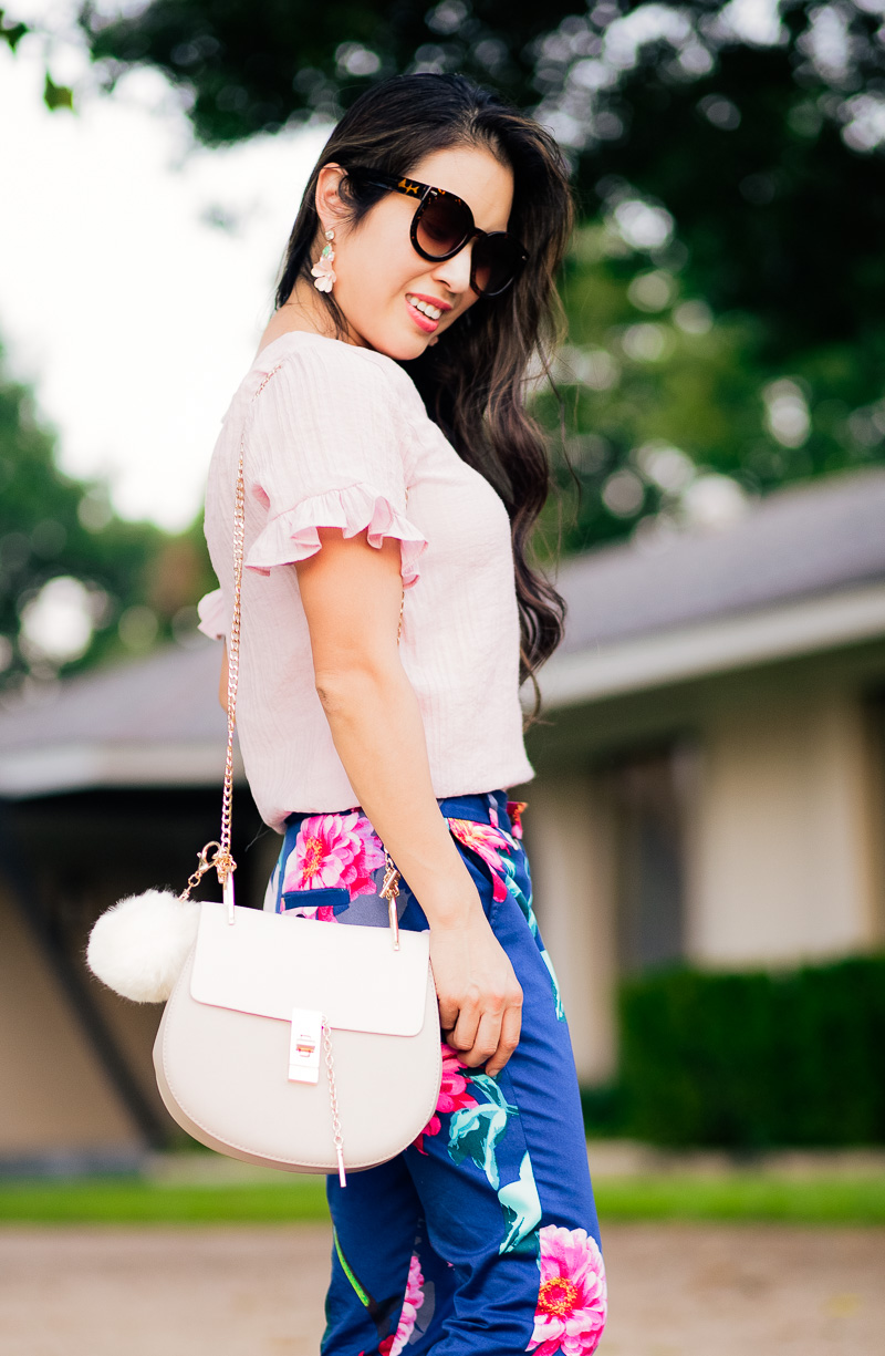 cute & little | petite fashion blog | flutter ruffle seersucker blouse, navy floral pants, pink tie pumps, chloe drew dupe bag, baublebar flower earrings | summer fall transition outfit