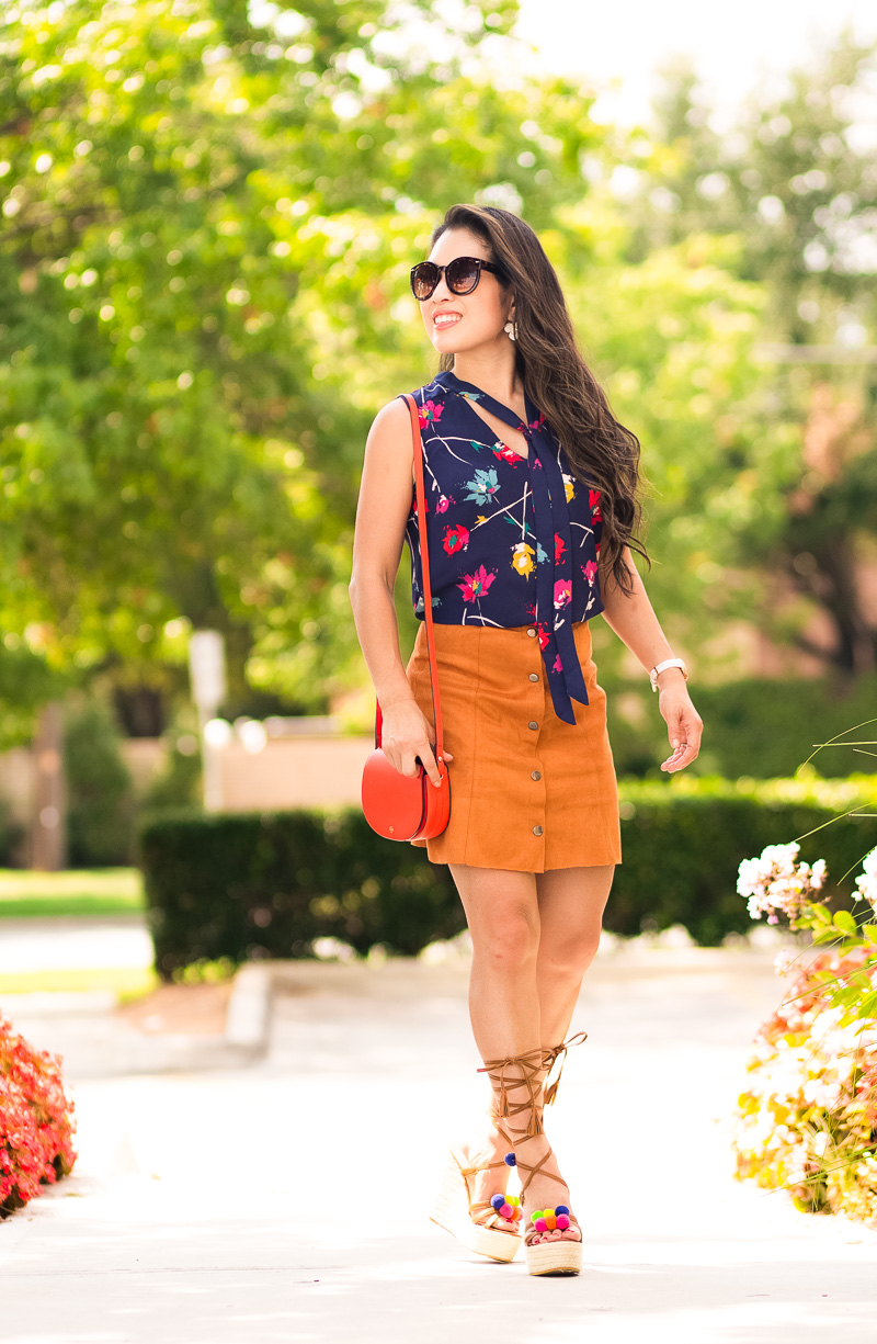 cute & little | petite fashion blog | navy floral tie blouse, suede button mini skirt, lace-up pom pom espadrille wedges, red saddle bag | summer fall transition outfit