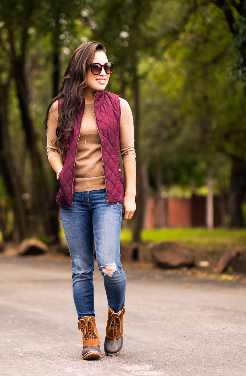cute & little blog | petite fashion | sorel winter fancy lace ii, plum puffer vest, camel tippi sweater, distressed jeans | fall winter outfit