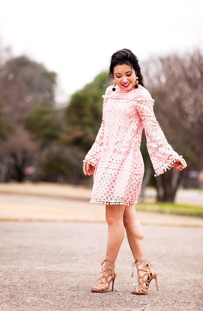valentines day activities: dressing up in a pink lace dress with pompoms featured by top US life and style blog, Cute & Little