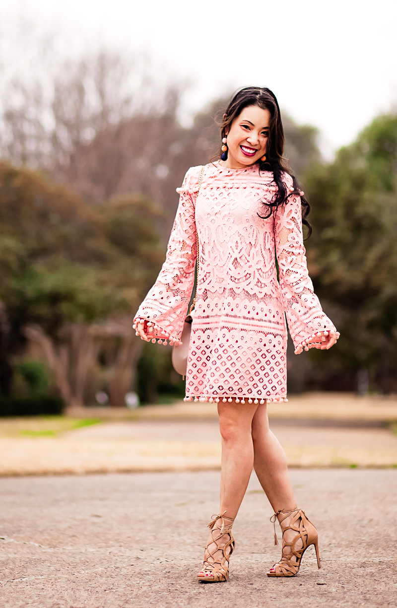 valentines day activities: dressing up in a pink lace dress with pompoms featured by top US life and style blog, Cute & Little
