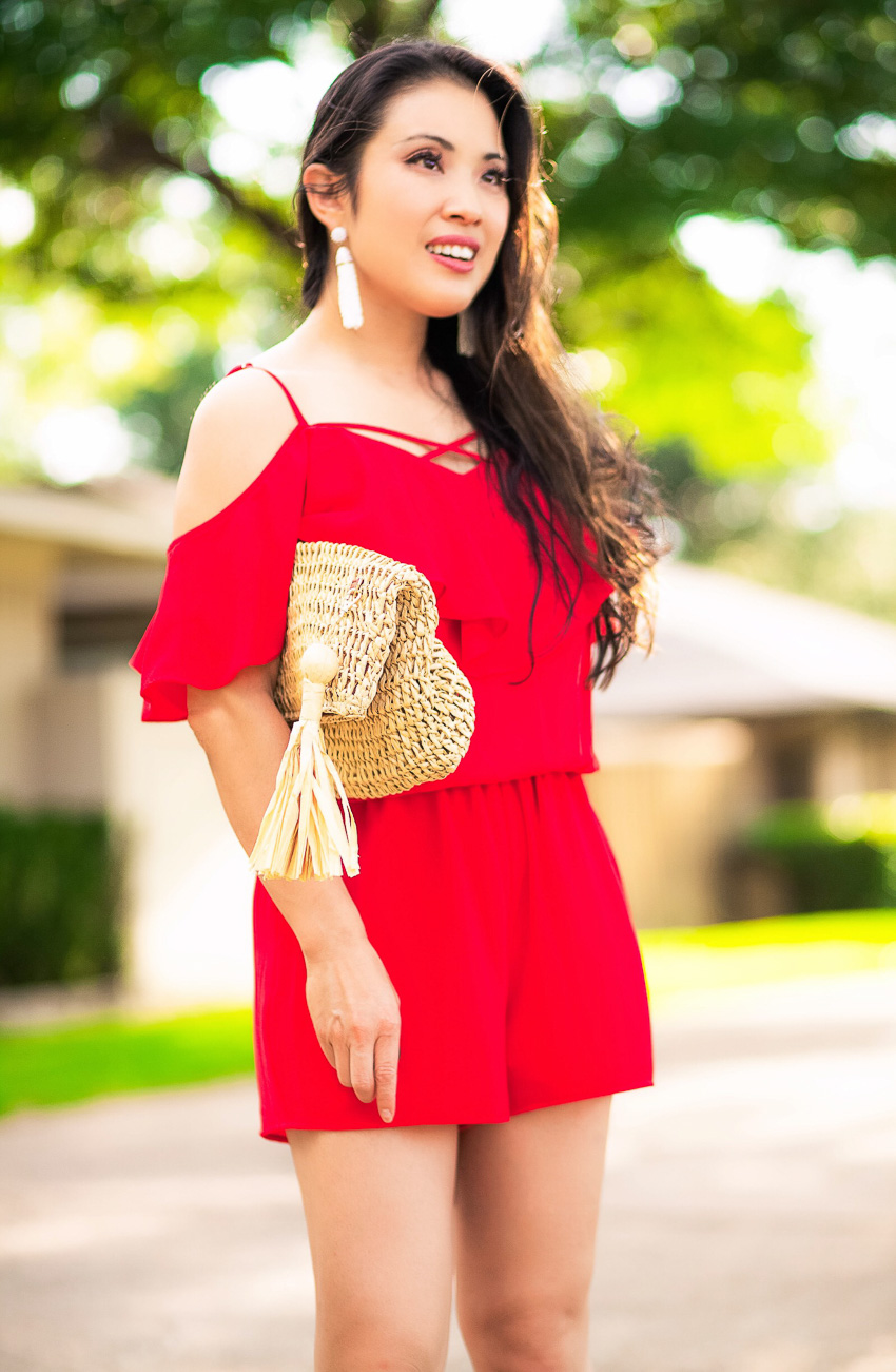 cute & little blog | dallas petite fashion blog | red ruffle crisscross romper, rattan straw clutch | summer festive outfit