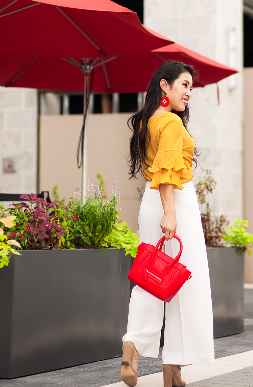 cute & little | dallas petite fashin blogger | mustard yellow ruffle blouse, white wide leg culottes, baublebar rosita drop earrings | how to style trends at the office
