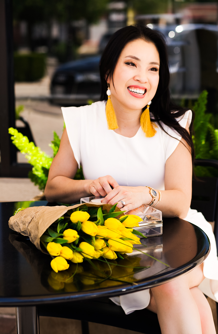 cute & little | spring style refresh | 3 accessories you need | express white ruffle dress, yellow pumps, yellow tassel earrings, anne klein crystal watch | mothers day