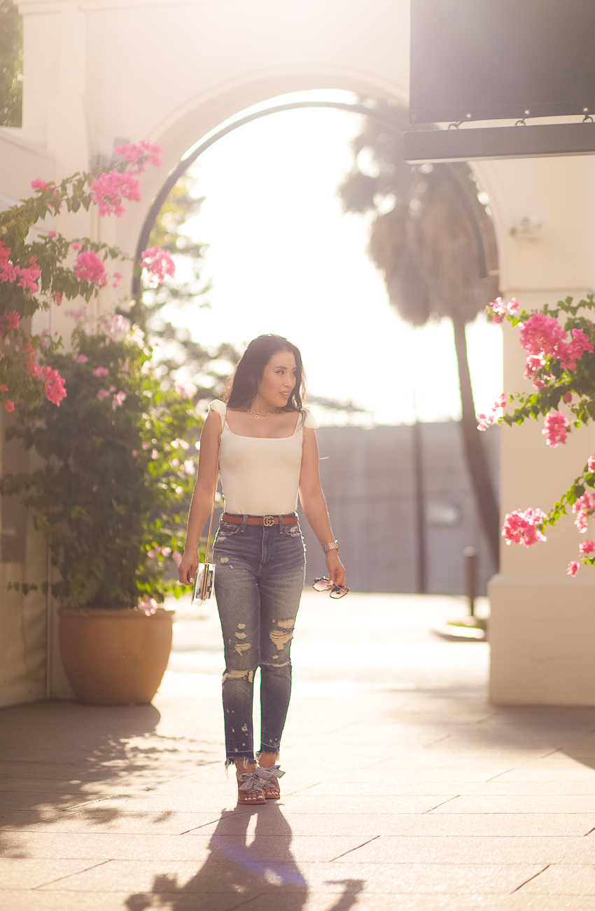 free people shoulder tie white bodysuit, abercrombie high rise mom jeans, dolce vita amber mules, gucci sunglasses - How To Rock The Mom Jean Trend (And Look Cool!) feature by popular Dallas petite fashion blogger Cute & Little