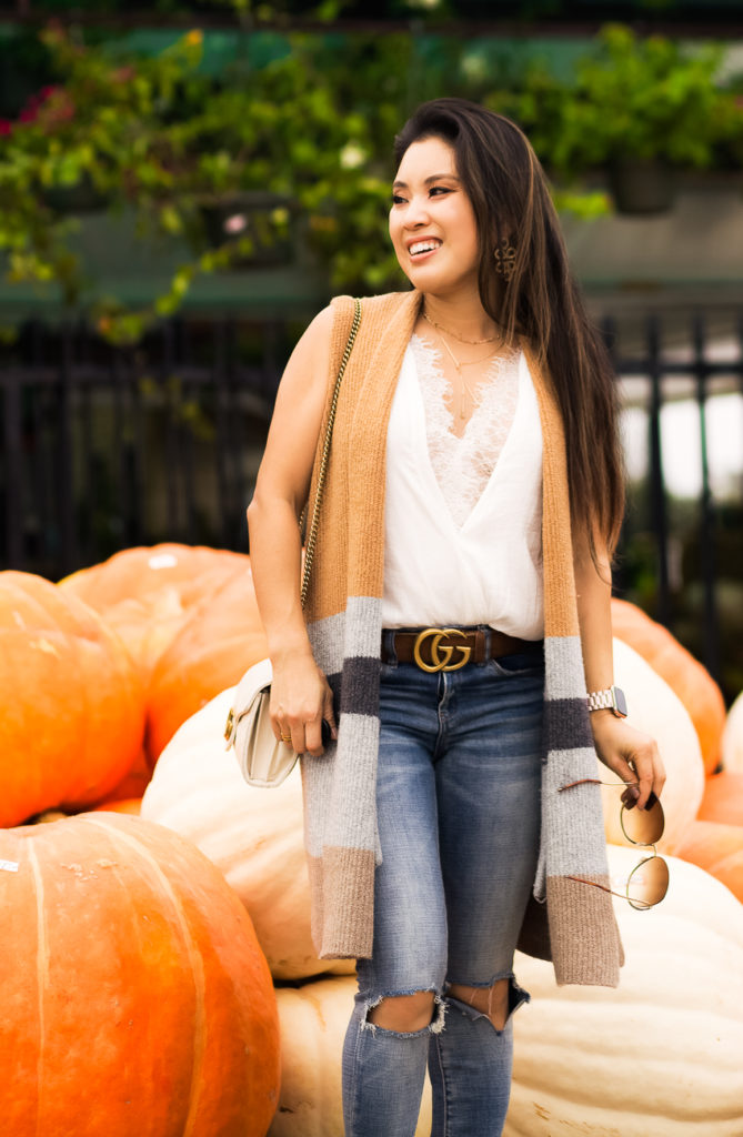 All The Fall Feels: Layering With A LOFT Sweater Vest featured by Dallas petite fashion blogger Cute & Little  | loft coloblock pocket sweater vest, lace top, blanknyc busted knee jeans, vince camuto movinta bootie, chloe milla sunglasses | fall output