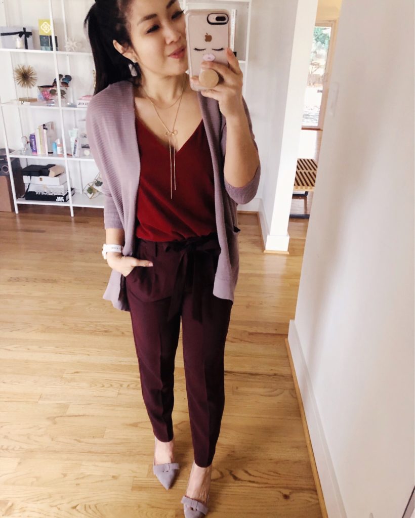 Valentine's Day Dress featured by top US fashion blog Cute & Little; Image of a woman wearing Express Textured Drop Shoulder Open Cardigan, Express Velvet Downtown Cami, Express High Waisted Sash Waist Ankle Pants, Express Rolled Sleeve Boyfriend Blazer.