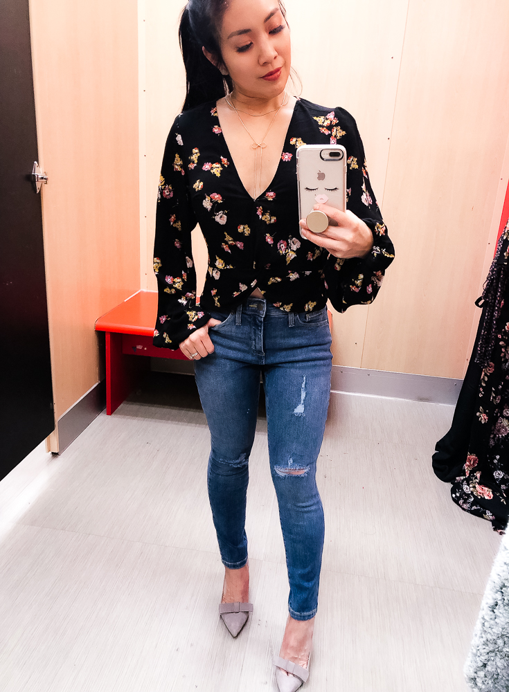 Shopping at Target featured by top US fashion blog Cute & Little; Image of a woman wearing Target Wild Fable Floral Twist Top, Target High Rise Crop Skinny Jeans, Ann Taylor 'Odette' Bow Pumps, Sugarfix for Baublebar Lariat Bow necklace and Garmin 'vivomove' HR watch.