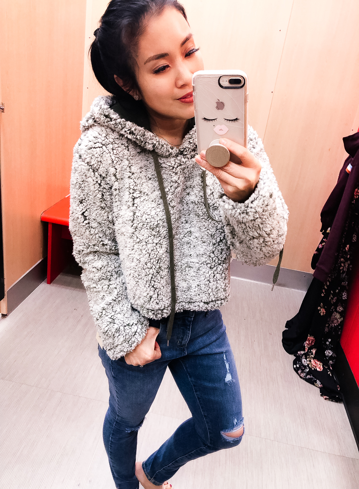 Shopping at Target featured by top US fashion blog Cute & Little; Image of a woman wearing Target Wild Fable Fuzzy Sherpa Hoodie and Target High Rise Crop Skinny Jeans.