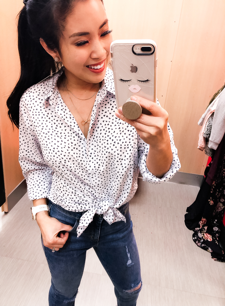 Shopping at Target featured by top US fashion blog Cute & Little; Image of a woman wearing Target Universal Thread Heart Print Shirt, Target High Rise Crop Skinny Jeans, Ann Taylor 'Odette' Bow Pumps, Sugarfix for Baublebar Lariat Bow necklace and Garmin 'vivomove' HR watch.