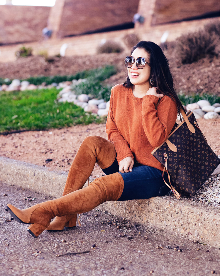 Amazon Winter Fashion featured by top US petite fashion blog Cute & Little; Image of a woman wearing Amazon Pom Pom Balls Sweater, AE 360 Next Level High Waisted Jeans, Tan Over-The-Knee Suede Boots, Louis Vuitton 'Neverfull' bag and Gucci GG0106S sunglasses.
