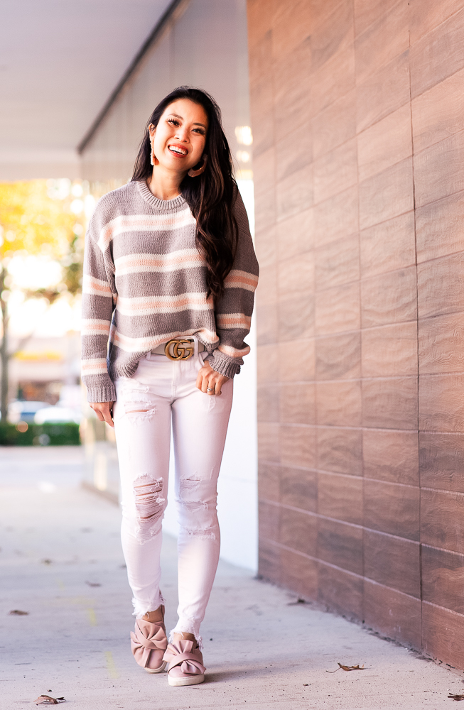American Eagle Sweaters featured by top US petite fashion blog Cute & Little; Image of a woman wearing American Eagle Slouchy Striped Pullover Sweater,  J.Brand White Jeans, Gucci Double G belt and pink bow sneakers
