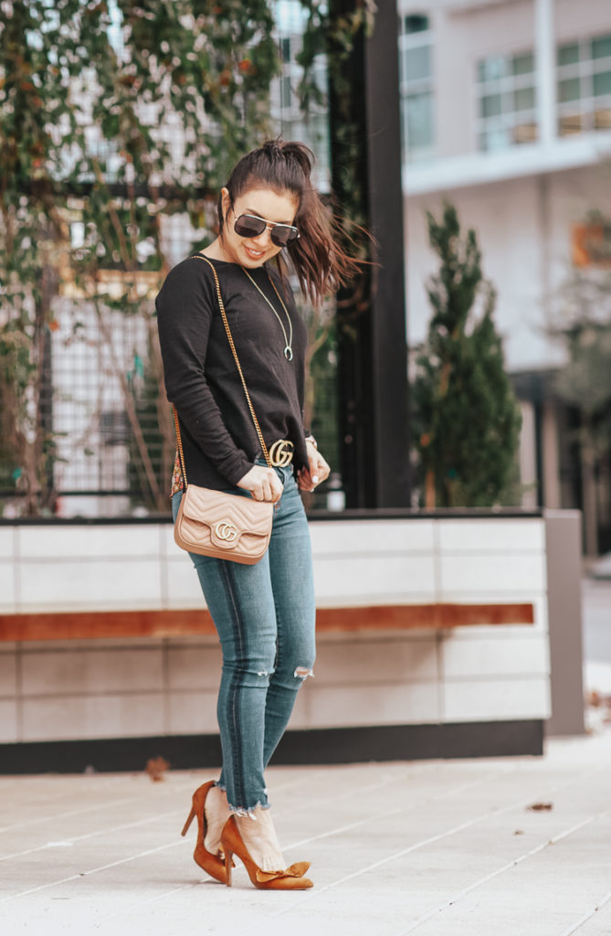Floral Fashion featured by top US petite fashion blog Cute & Little; Image of a woman wearing loft split back mixed media floral sweater, abercrombie high rise ankle jeans, mustard bow pumps, gucci statement belt and gucci crossbody dupe.