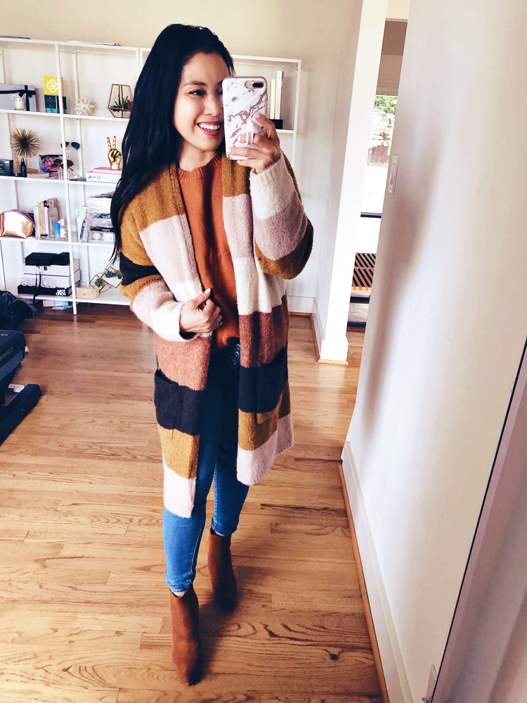 Amazon Winter Fashion featured by top US petite fashion blog Cute & Little; Image of a woman wearing Amazon Striped Colorblock Cardigan, Amazon Pom Pom Balls Sweater, American Eagle Button-Fly Jeans and Marc Fisher 'Alva' shoes.