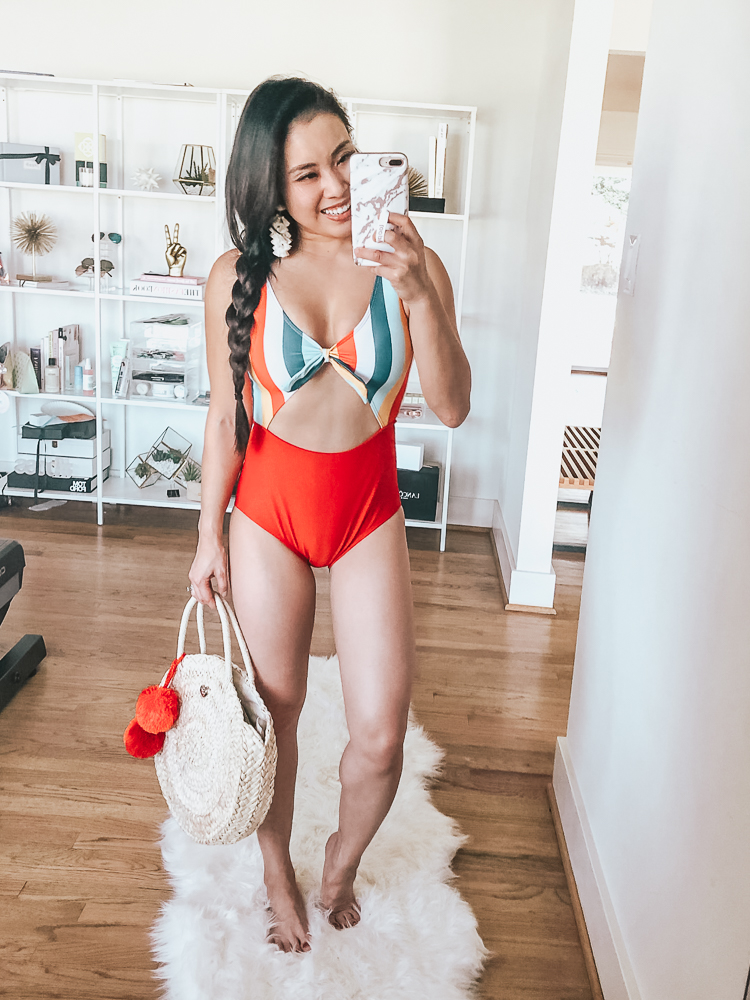 Shein Swimsuits featured by top US petite fashion blog Cute & Little; Image of a woman wearing a Shein rainbow striped cutout one-piece swimsuit