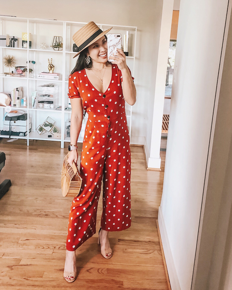 Spring Dresses featured by top US petite fashion blog Cute & Little; Image of a woman wearing target xhileration polka dot jumpsuit, straw boater hat, cult gaia small ark clutch.