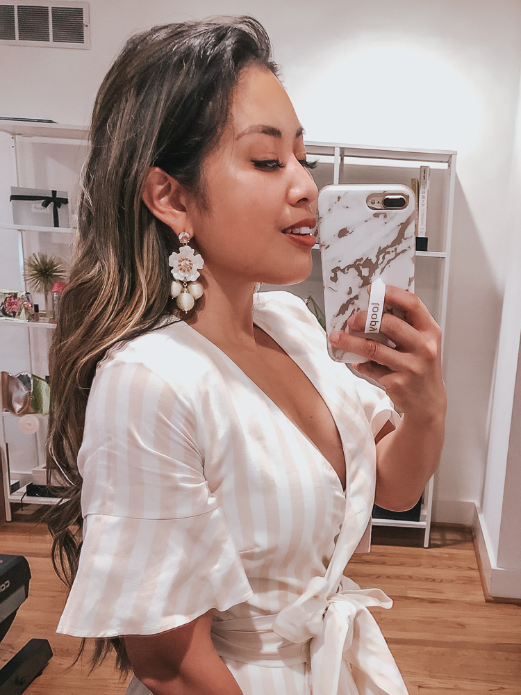 Rachel Parcell x Nordstrom featured by top US fashion blog cute & little; Image of a woman wearing Floral Statement Chandelier Earrings and Rachel Parcell Ruffle Wrap Dress.