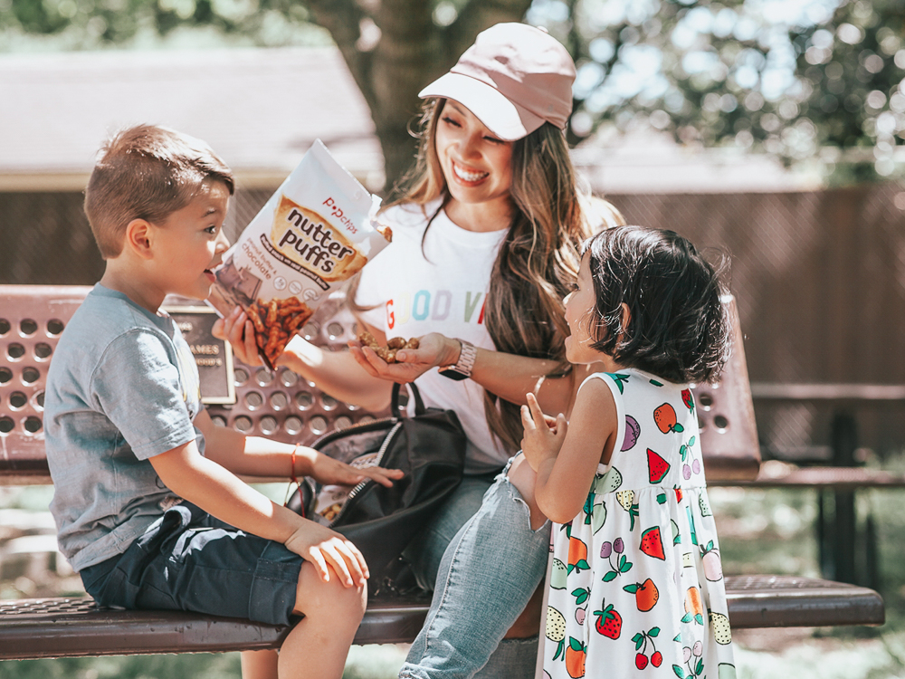 Healthy Snacks On-The-Go featured by top US lifestyle blog Cute & Little; Image of a woman playing with her kids at the park.