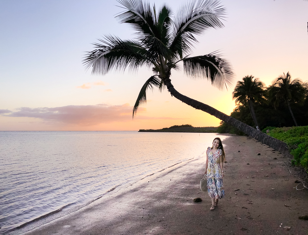 Visiting Molokai featured by top US travel blog Cute & Little; Image of a woman wearing J.Crew Point Sur Dress, Amazon Straw Tote, Tory Burch 'Miller' Sandals and Baublebar Heart Hoop Earrings.