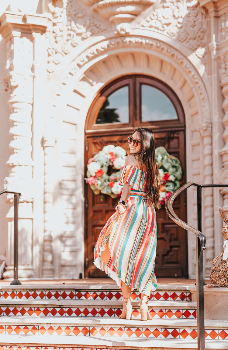 Spring Refresh featured by top US lifestyle blog Cute & Little; Image of a woman wearing a red dress boutique luau with me stripe 2-piece dress set