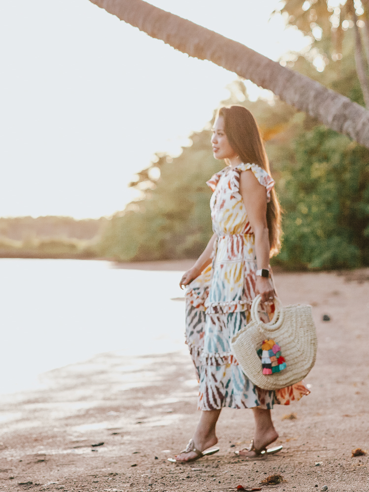 J Crew Midi Dress featured by top US petite fashion blog Cute & Little; Image of a woman wearing j.crew flutter sleeve midi dress, tory burch miller sandals, amazon fashion straw tote and baublebar earrings.