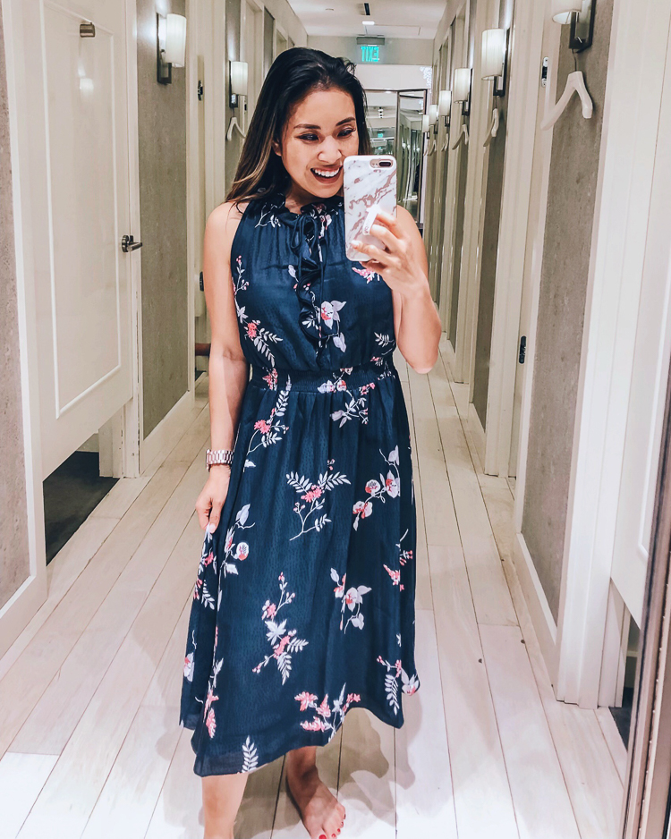 Ann Taylor Flash Sale featured by top US fashion blog Cute & Little; Image of a woman wearing Ann Taylor floral halter ruffle flare dress.