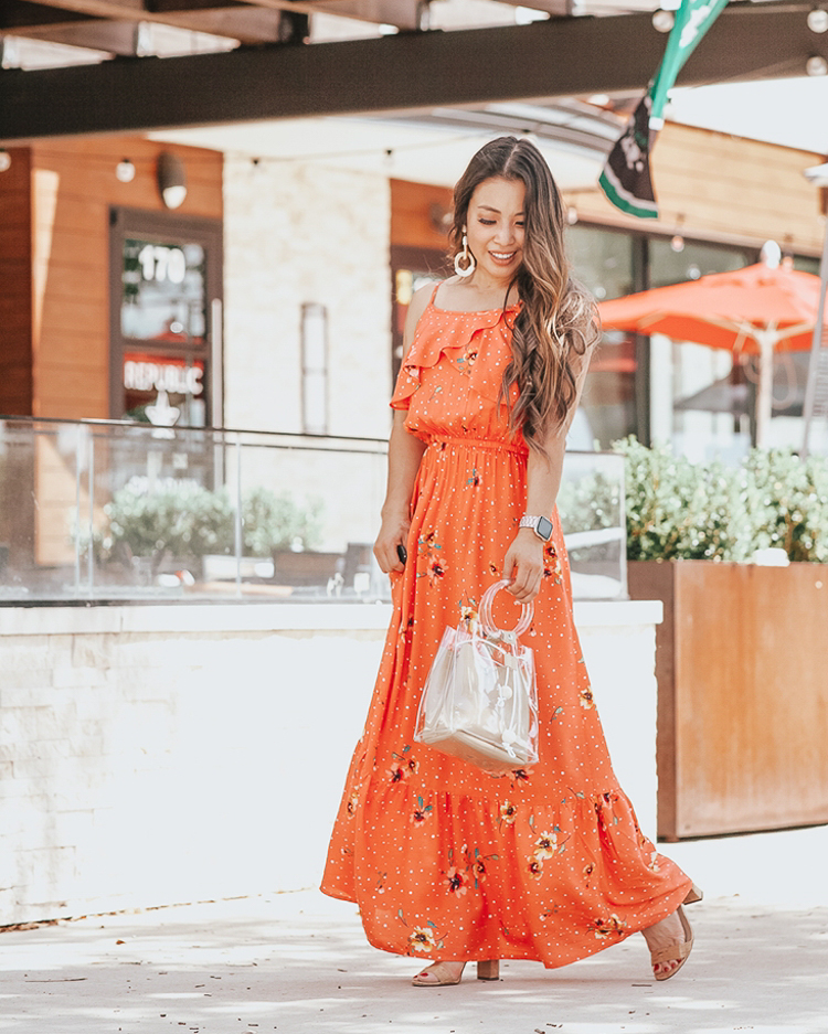 Best Memorial Day Weekend Sales featured by top US fashion blog cute & little; Image of a woman wearing a JCPenney floral maxi dress and Amazon clear tote.