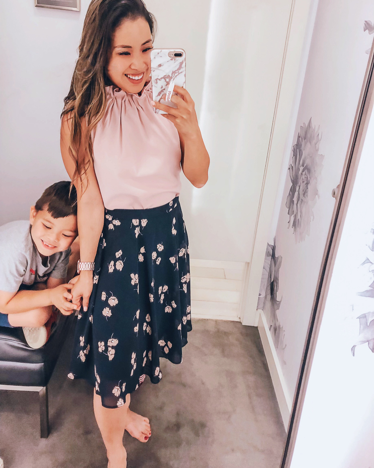 Ann Taylor Flash Sale featured by top US fashion blog Cute & Little; Image of a woman wearing ann taylor pink ruffle neck shell and ann taylor chiffon floral full skirt.