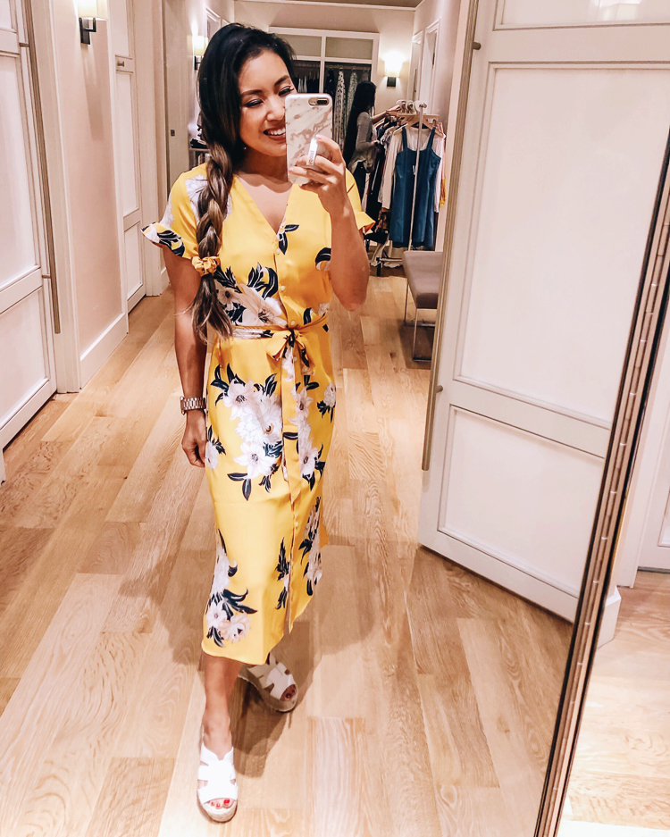 LOFT Favorites featured by top US petite fashion blog Cute & Little; Image of a woman wearing loft yellow floral bouquet flutter shirt dress.
