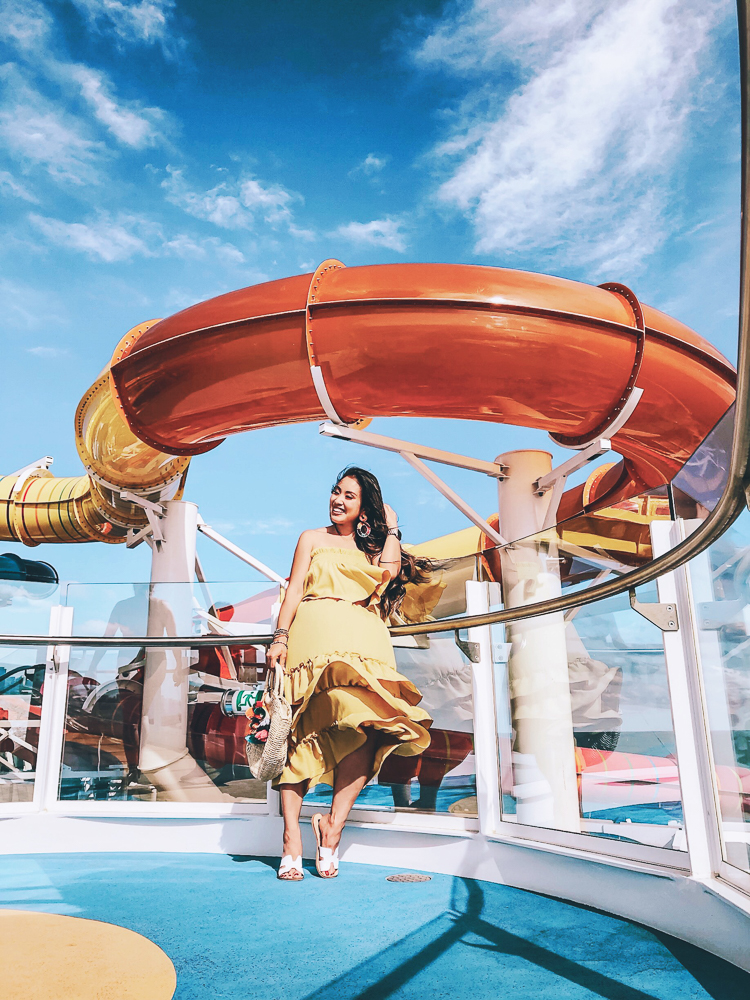 First Time Cruise Tips featured by top US travel blog Cute & Little; Image of a woman wearing Amazon midi dress and Steve Madden sandals.