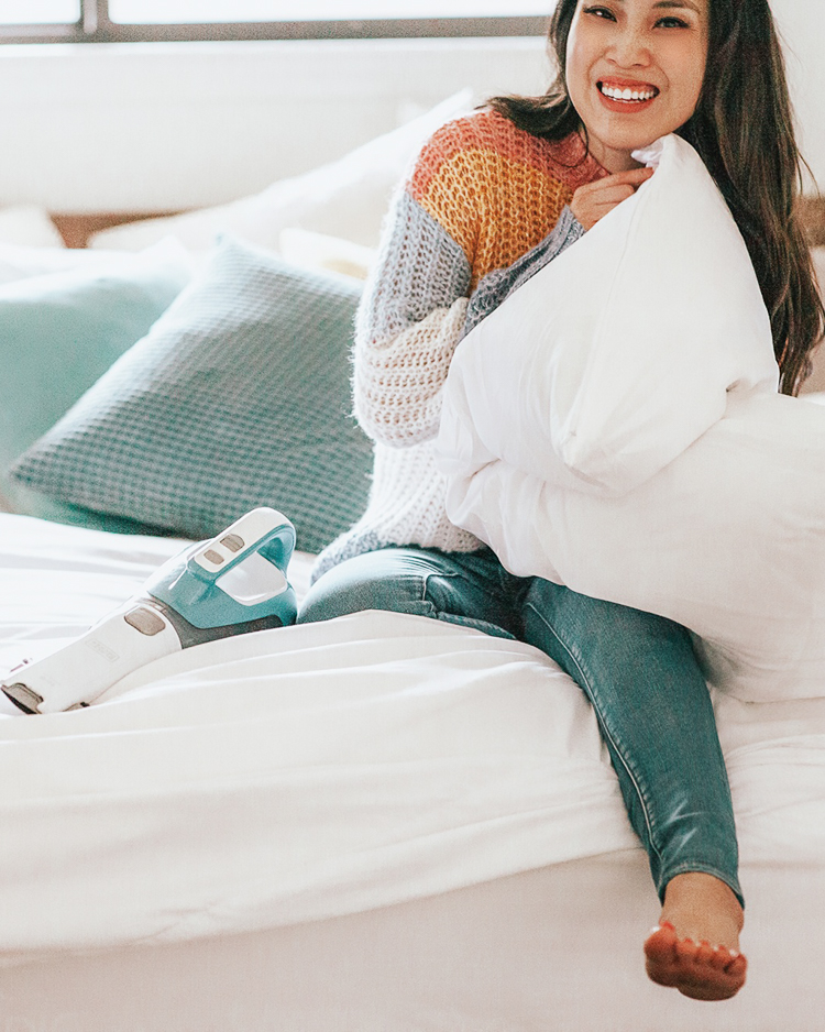 cute & little | popular dallas petite fashion blog | amazon home deals | amazon prime day | Amazon Prime Day 2019 Top Picks by popular Dallas petite lifestyle blog, Cute and Little: image of a woman sitting in bed with Amazon Black+Decker Dust Buster, Amazon Duvet Cover, Amazon Silk Pillowcase, and wearing an Amazon Stripe Sweater.