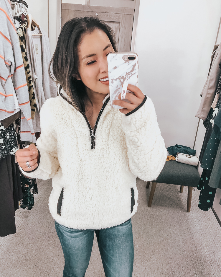 cute & little | dallas popular petite fashion blog | nordstrom anniversary sale 2019 dressing room try-on | thread supply wubby fleece pullover | best of 2019 nsale | Nordstrom Anniversary Sale Try-On by popular Dallas petite fashion blog, Cute and Little: image of a woman in a Nordstrom dressing room wearing a Thread & Supply Wubby Fleece Pullover.