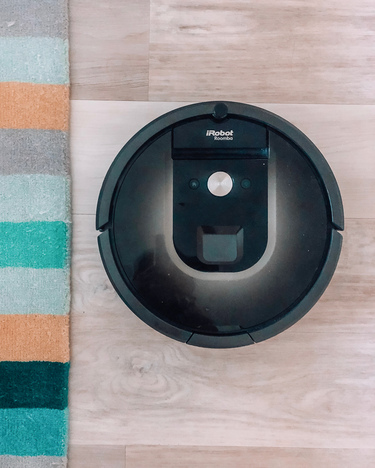 cute & little | popular dallas petite fashion blog | roomba | amazon prime day | Amazon Prime Day 2019 Top Picks by popular Dallas petite lifestyle blog, Cute and Little: image of an iRobot roomba 980 on a light wood floor next to a multi color stripe rug.