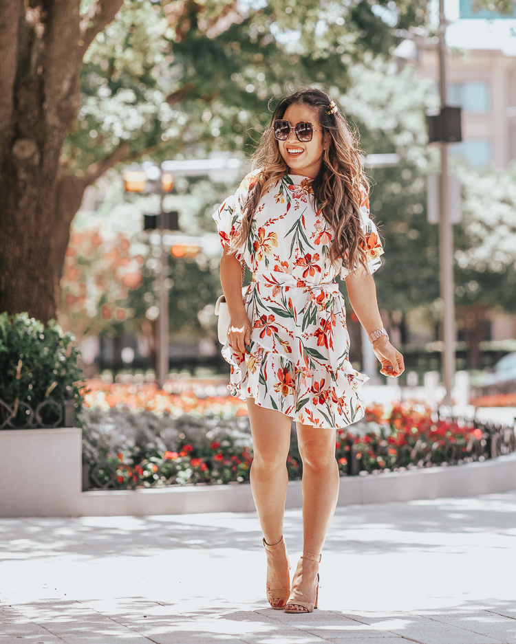 cute & little | dallas fashion blog | top 10 dallas brunch restaurants family kid friendly | shein white floral ruffle wrap dress | summer fall wedding guest outfit | Best Brunch In Dallas: 10 Restaurants To Try by popular Dallas blog, Cute and Little: image of a woman outside and wearing a Shein Floral Print Ruffle Hem Belted Dress, Etsy Rhinestone “GUCCI” Inspired Hair Clip, Etsy Bling Babes Code Gold Rhinestone Xoxo hair clip, Gucci GG Marmont small matelassé shoulder bag, and Gucci GG 0106 S- GG0106S Sunglasses 56mm.