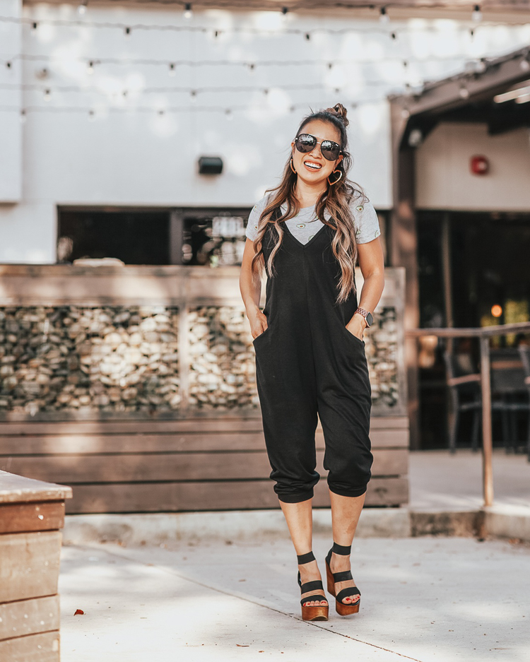 cute & little | popular dallas petite fashion blog | target wild fable sleeveless black jumpsuit, quay sunglasses | casual summer fall outfit | August 2019 Top Sellers by popular Dallas petit fashion blog, Cute and Little: image of a woman wearing a Target Wild Fable Women's Sleeveless V-Neck Knit Cropped Jumpsuit.