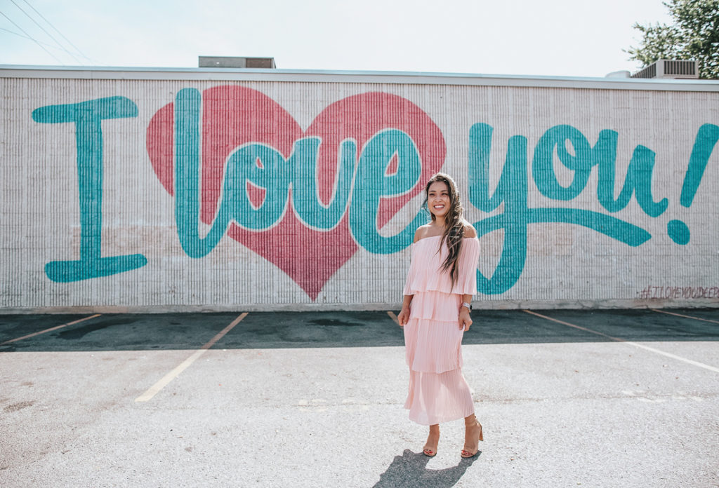 cute & little | popular dallas fashion blog | dallas mural guide | instagram walls | i love you wall | deep ellum | Dallas Mural Guide: Top 10 Instagram Walls by popular Dallas blog, Cute and Little: image of a woman standing in front of a I Love You mural and wearing and tiered off the shoulder ruffle dress and sam edelman sandals.