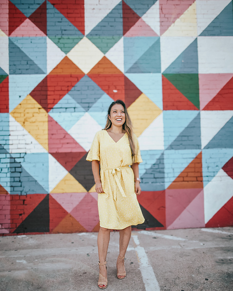 cute & little | popular dallas fashion blog | dallas mural guide | instagram walls | geometric shapes wall | deep ellum | Dallas Mural Guide: Top 10 Instagram Walls by popular Dallas blog, Cute and Little: image of a woman standing in front of a geometric shapes mural and wearing a Target A New Day Women's Regular Fit Short Sleeve V-Neck Tie-Waist Woven Dress and Sam Edelman shoes. 
