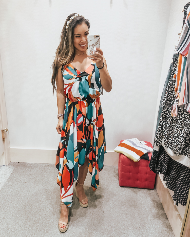 cute & little | popular dallas fashion blog | evereve august summer 2019 try-on | evereve libby hollie wodward hankerchief dress | Evereve Summer Collection 2019 Try-On by popular Dallas fashion blog, Cute and Little: image of a woman in a dressing room trying on evereve libby hollie wodward hankerchief dress, Steve Madden Womens Survive shoes, HUDA BEAUTY Liquid Matte Lipstick, and holding a Loopy Cases Loopy MAX - iPhone 6/7/8 PLUS.