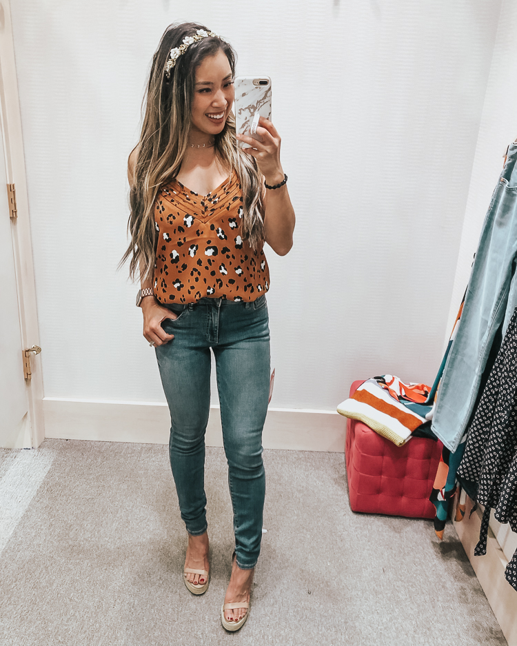 cute & little | popular dallas fashion blog | evereve august summer 2019 try-on | evereve leopard strappy cami, kut from the kloth donna ankle skinny jeans | Evereve Summer Collection 2019 Try-On by popular Dallas fashion blog, Cute and Little: image of a woman in a dressing room trying on evereve leopard strappy cami and kut from the kloth donna ankle skinny jeans