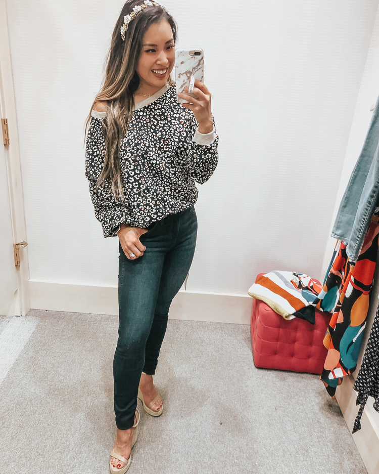 cute & little | popular dallas fashion blog | evereve august summer 2019 try-on | sunday inbrooklyn leopard top, kut from the kloth mia high rise skinny jeans | Evereve Summer Collection 2019 Try-On by popular Dallas fashion blog, Cute and Little: image of a woman in a dressing room trying on Evereve sunday inbrooklyn leopard top and kut from the kloth mia high rise skinny jeans