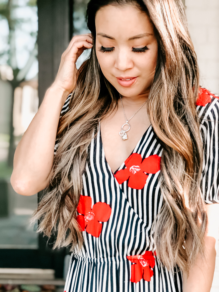 cute & little | popular dallas beauty blog | 5 products tools to beat frizzy hair | Rev-Air Review + GIVEAWAY by popular Dallas beauty blog, Cute and Little: image of a woman looking down at the ground and running her fingers through her hair.