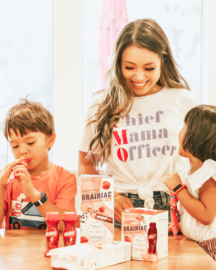 cute & little | popular dallas mom parenting blog | kids healthy quick easy breakfast ideas school | brainiac yogurt review | 5 Easy Breakfast Ideas for Kids That Maximize Brain Power by popular Dallas lifestyle blog, Cute and Little: image of mom and her kids in the kitchen eating Brainiac yogurts.