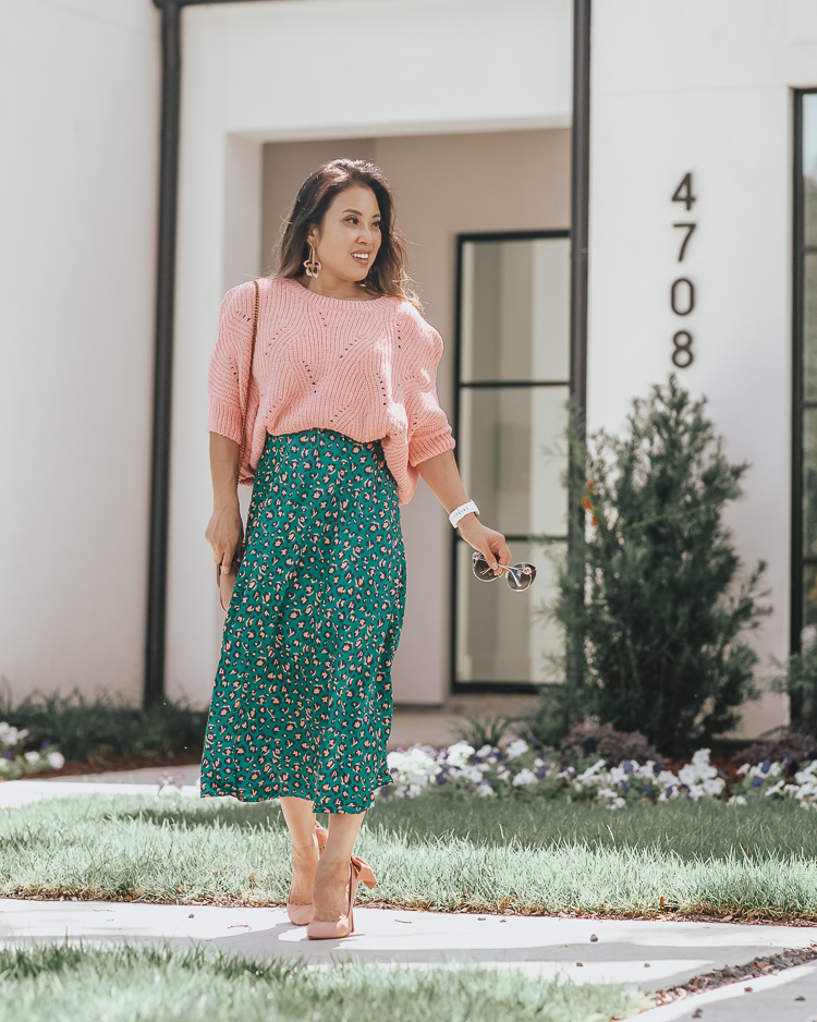 cute & little | popular dallas fashion blog | green animal print leopard midi skirt, pink ribbed chenille sweater, pink bow pumps | summer fall work office outfit | A Green Take On The Animal Print Midi Skirt by popular Dallas petite fashion blog, Cute and Little: image of a woman standing outside and wearing a Forever 21 Ribbed Chenille-Knit Sweater, Nordstrom Pamela Print Bias Cut Midi Skirt, Amazon SCHUTZ Women's Blasiana Pump, Nordstrom Baublebar Orchid Drop Earrings, Amazon Beatfull Bee Shoulder Bag for Women, Target Fitbit Versa Lite Smartwatch, and Gucci 63mm Open Temple Sunglasses.