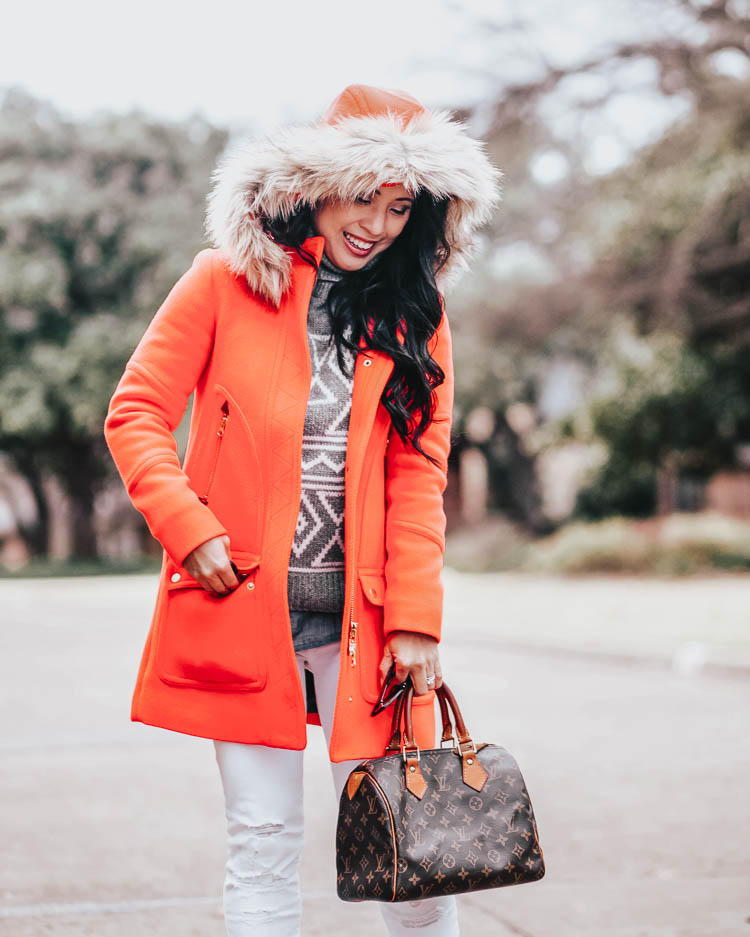 cute & little | dallas petite fashion blog | j.crew chateau parka coat, fair isle sweater | winter cold outfit | Best of Black Friday Deals and Sales 2019 by popular Dallas life and style blog, Cute and Little: image of a woman standing outside and wearing a J. Crew Chateau parka in Italian stadium-cloth wool, J. Crew Graphic Fair Isle sweater, Bloomingdales J Brand Alana High Rise Crop Jeans in Destructed Blanc and holding a Fashionphile LOUIS VUITTON Monogram Speedy 25.