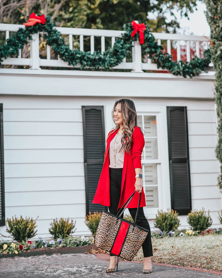 Cute Holiday outfit styled by top US petite fashion blog, cute & little: image of a woman wearing a Chico’s red cardigan, Chico’s sweater tank, Chico’s ankle pants, Chico’s jewelry and Chico’s animal print tote. | cute & little | chicos winter holiday festive outfit | chicos red rib mix cardigan holly red, chicos vintage taupe sweater tank, chicos juliet ankle black pants, chicos faux suede leopard tote