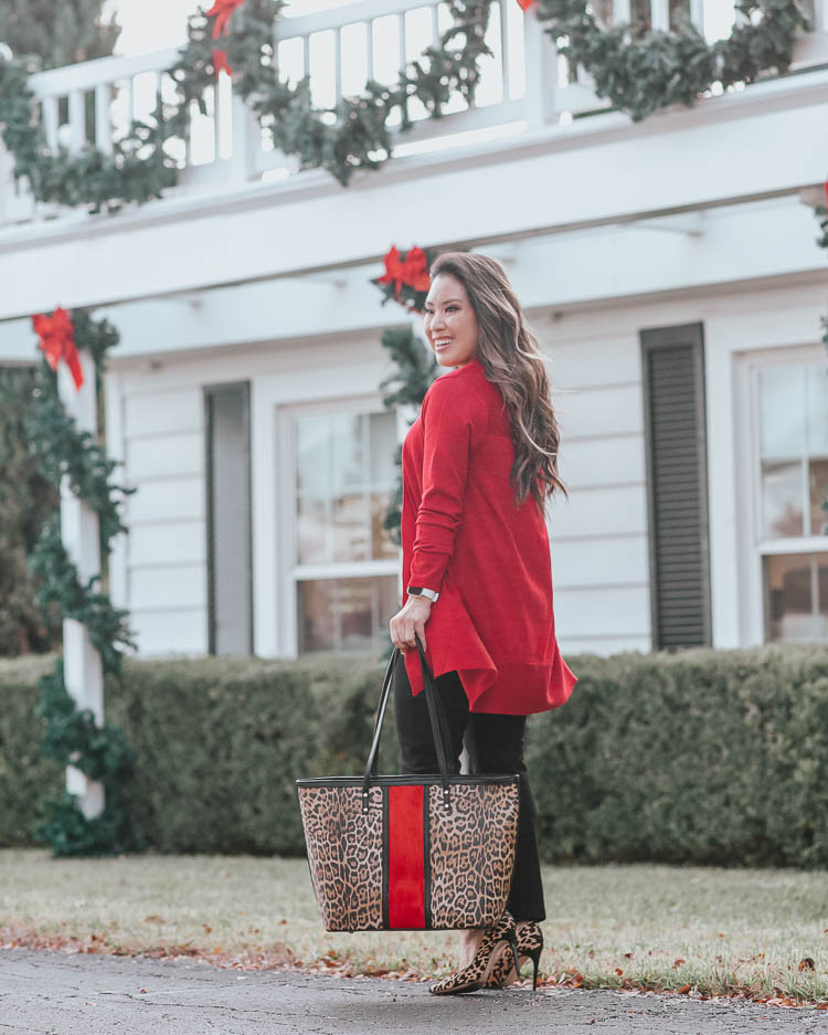 Cute Holiday outfit styled by top US petite fashion blog, cute & little: image of a woman wearing a Chico’s red cardigan, Chico’s sweater tank, Chico’s ankle pants, Chico’s jewelry and Chico’s animal print tote. | cute & little | chicos winter holiday festive outfit | chicos red rib mix cardigan holly red, chicos vintage taupe sweater tank, chicos juliet ankle black pants, chicos faux suede leopard tote